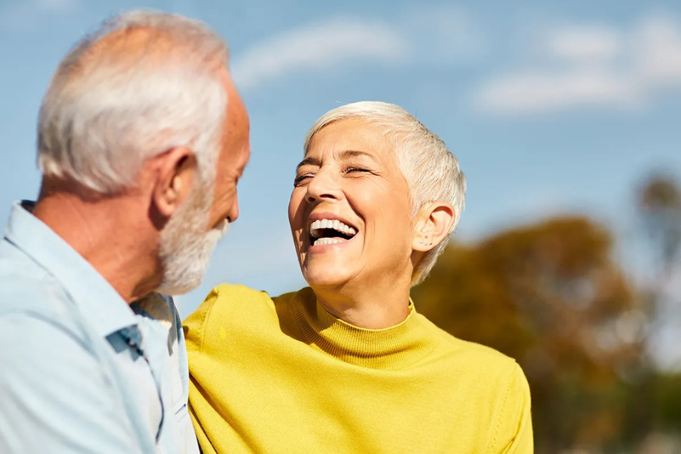 Smiling older couple enjoying time outdoors together